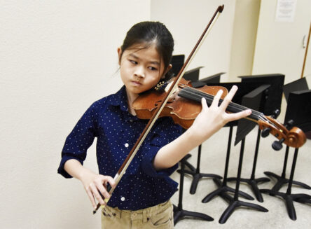 a child playing violin